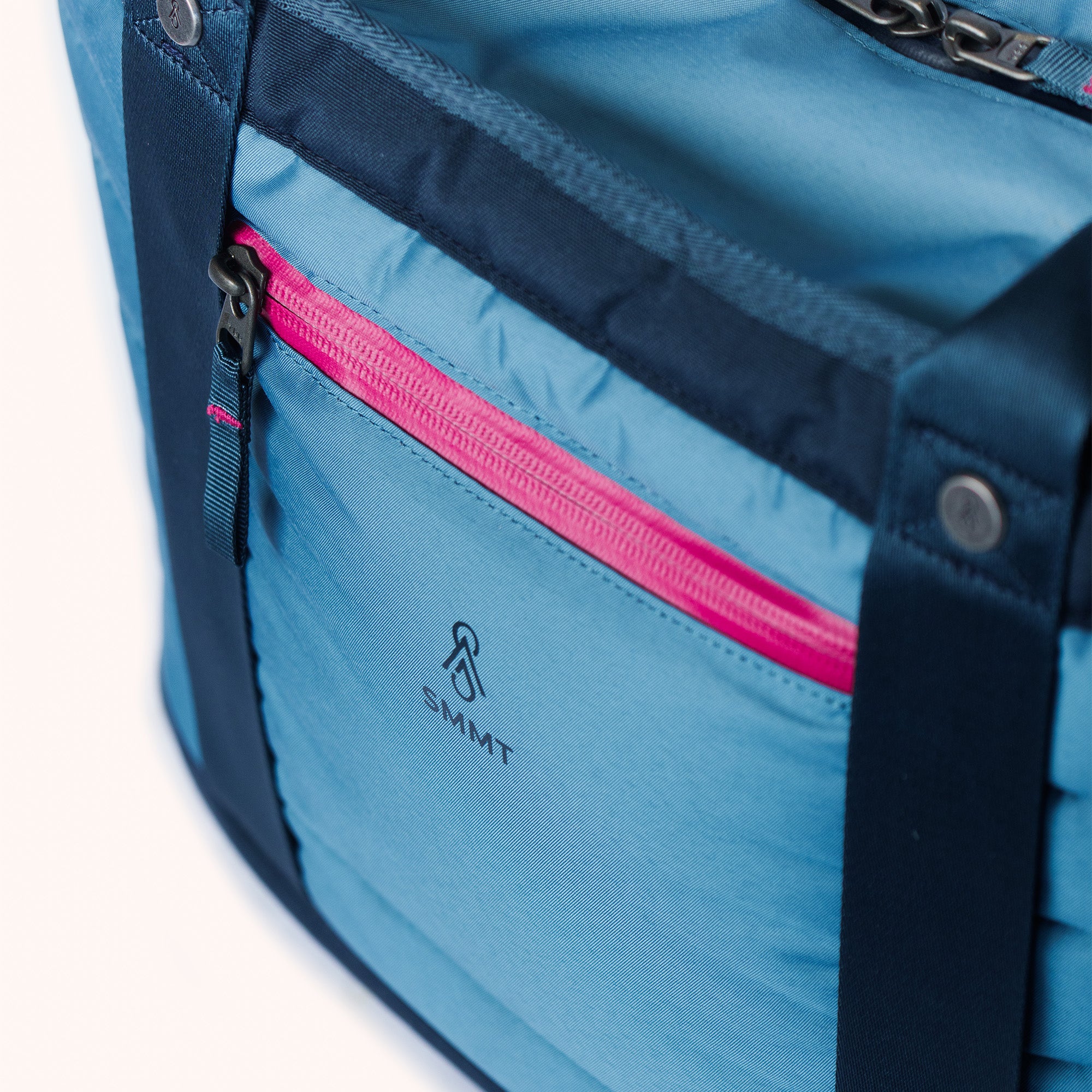 pink zipper and logo detail on front of smmt tote bag