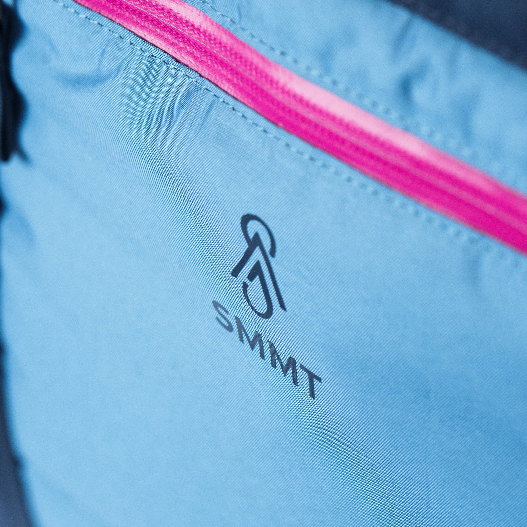 SMMT logo printed below the pink zipper on the 35 liter powderloft bag