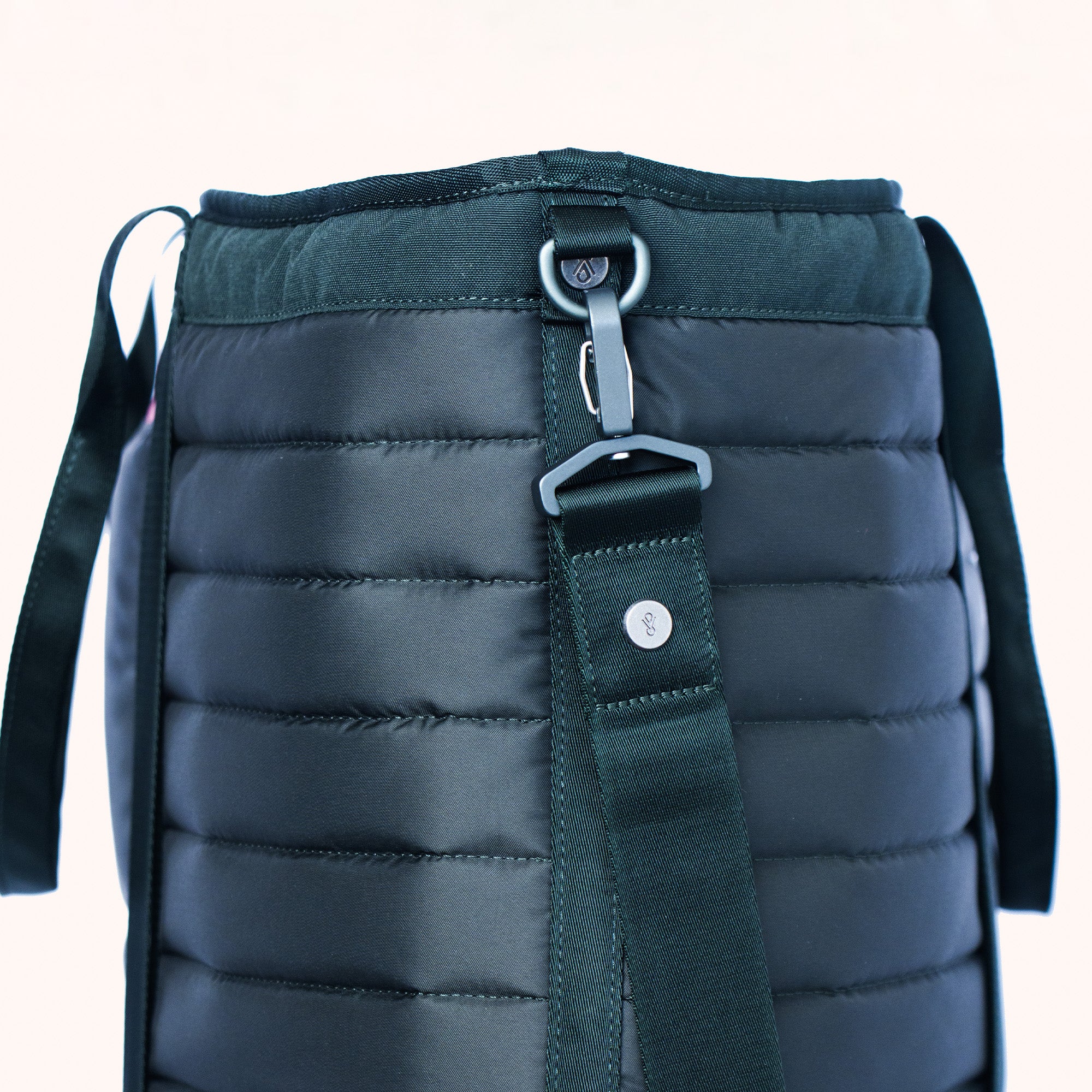 shoulder strap and metal rivet detail on tote bag