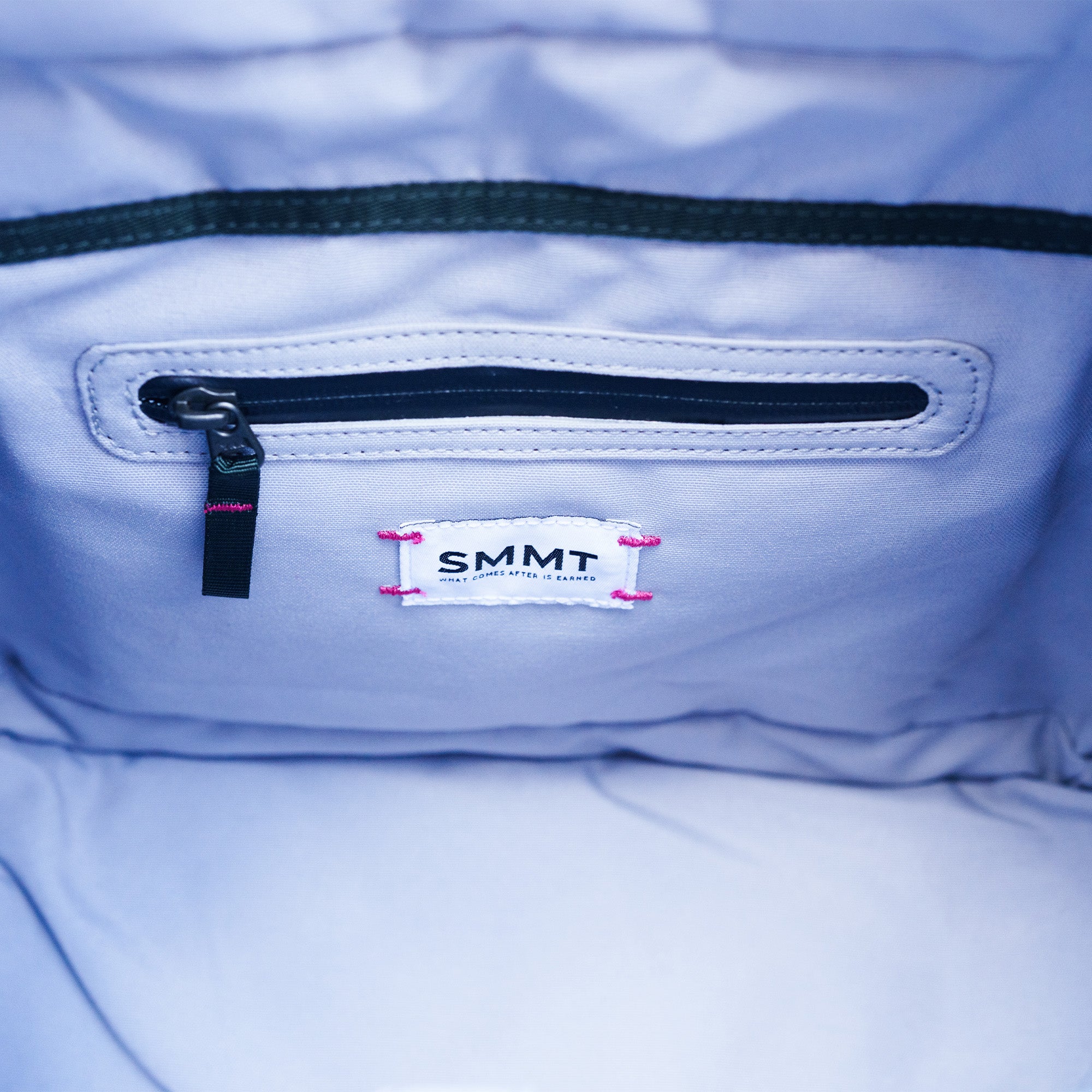 interior zipper and pink stitching detail on smmt tote bag